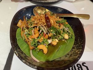 Neem salad with vegan fish sauce at Vegan Mahanakhon in Bangkok
