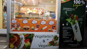 store front displaying the menu at Cigköftem - Karl Marx in Berlin