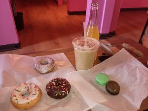 Donuts, macarons, and a vanilla iced latte at Café Mas in Chicago