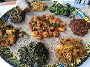 This is the vegetarian sampler with the shrimp appetizer in the middle….  at Enjera in Arlington