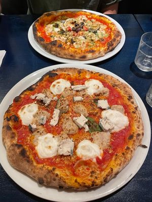 Quattro fromaggio and parmigiana pizzas  at Meow Pizzeria Verde in Innsbruck