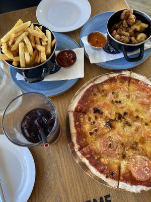 Pizza with vegan cheese, fries and fried cauliflower   at The Good Home in Pegasus