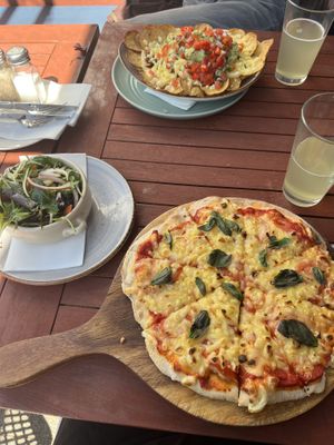 Nachos, margarita pizza and side saladd  at The Good Home in Pegasus