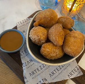 Loukoumades dessert (Greek doughnuts in cinnamon sugar with biscoff dipping sauce)  at Artezzan  in Chester
