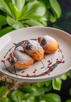 Black sesame stuffed doughnuts! Brought me back to my childhood of the crispy sweet exterior and the fluffiness of the dough inside! 🤤  at Replika in Dubai