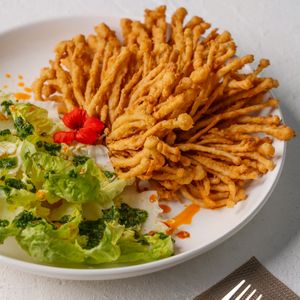 Something beyond different! Crispy enoki mushrooms I’m a gem lettuce wrap served with a spicy sweet chimichuri sauce!  at Replika in Dubai