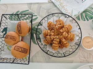 Blooming onion and burger sliders at Replika in Dubai