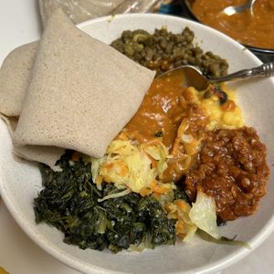 Injera (bread,) red lentils (spicy,) yellow split peas, greens, cabbage and carrots, beets and potatoes, brown lentils and shiro wot (sauce.) ALWAYS GET THE SHIRO WOT the best!  at Gursha Ethiopian Cuisine in Roseville