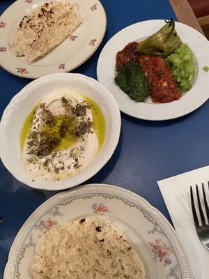 Pita, labneh (centre), spicy plate (right)  at Goli Restaurant in Budapest