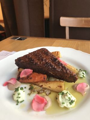 Amazing tempeh with root vegetables  at Moment in Prague