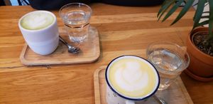Golden and matcha lattes at Moment in Prague