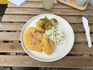 Fried cauliflower with celery in soyannaise and baked potatoes with spring onion  at Moment in Prague
