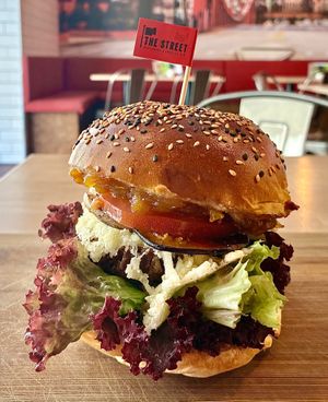 Grilled pear, onion chutney, Parmesan, eggplant bacon, and walnut & maple syrup burger at The Street - Belehradska in Prague