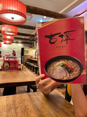 View inside and menu with name at Ramen Kotan in Osaka