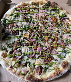 Vegan Guajillo Mushroom
Marinated Guajillo Mushrooms, Pickled Onions, and Spinach topped with a Cilantro Salsa Verde on our thin Sourdough Crust + soy-based vegan cheesee  at Nick's Pizza in Oakland