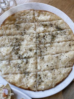 Vegan Garlic Fingers: vegan garlic sauce, vegan mozzarella & coconut donair sauce  at The Wooden Monkey in Halifax