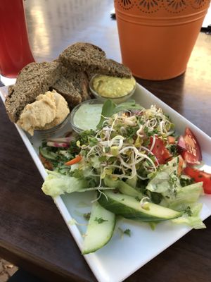 Salad with bread and different kind of dips at Symbiose in Leipzig