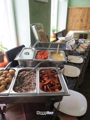 Sunday brunch, incl.: fake meat slices (seitan), German-style potato salad, a Mediterranean vegetable bolognese, a bean and mushroom casserole, potato soup, roasted pumpkin wedges, boiled potatoes, curry falafel and a pear and chocolate crumble. at Symbiose in Leipzig