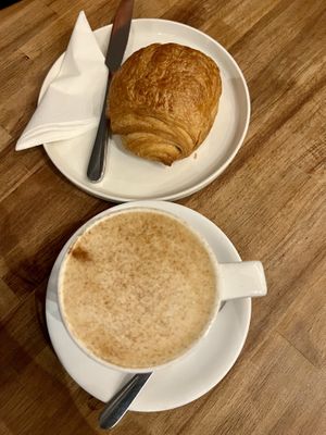 Banana bread latte with oat milk + vegan pain au chocolat   at XOKO in Inverness