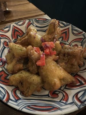 Battered and fried broccoli with spicy drizzle  at Shado Beni Caribbean Tapas Lounge in Caye Caulker