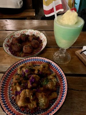 Battered broccoli and samosa balls    at Shado Beni Caribbean Tapas Lounge in Caye Caulker