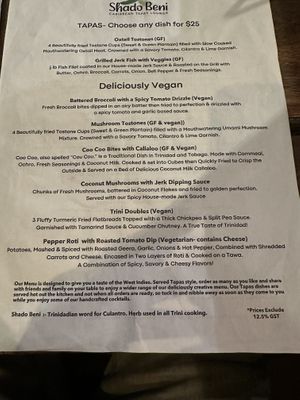 Menu. The trini doubles are confirmed vegan per the server.  at Shado Beni Caribbean Tapas Lounge in Caye Caulker