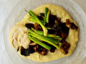 Mushroom masabacha. Fava bean hummus with grilled mushrooms and scallions, with tahini on the side.  at Zakaim - Vegan Boutique in Tel Aviv