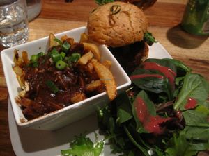 Cajun burger with a side salad. This is normally served with French fries, but you can transform your fries for a small vegan poutine for just a dollar or two. I really like this dish. at Lola Rosa - Parc in Montreal
