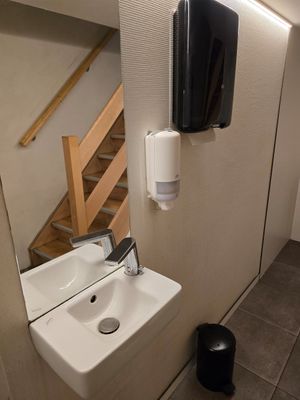 Sink at toilet downstairs at Frituur Hazegras in Oostende