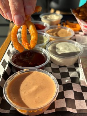 Homemade sauces and curly fries at Planet Vegan in Fresno