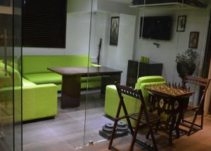 Plush sofa enclosure at Paradigm Shift Vegan Cafe in Bangalore