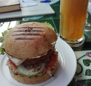 Yummy Tofu Burger with fresh Apple Juice at Paradigm Shift Vegan Cafe in Bangalore