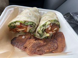 House buttermilk fried chick’n patty, romaine, tomato, & onion tossed w/ house Caesar + wrapped in a flour tortilla. Add a side of house Bacun  at The Smokin' Onion in Asheville