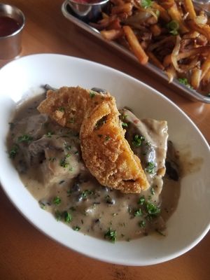 Biscuits and gravy hold the franks red hot sauce at The Smokin' Onion in Asheville