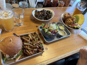 Cluckin’ good chick’n sandwich, brussel sprouts, chimichanga, and a side salad. Amazing!!!  at The Smokin' Onion in Asheville