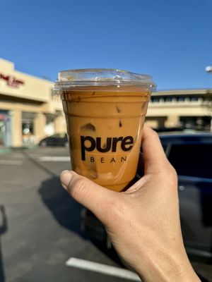 Iced Americano with Splash of Oat Milk   at Pure Bean  in Manhattan Beach