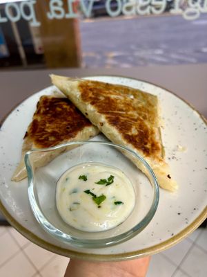 Phyllo dough samosa with soy yogurt sauce at Baak Libreria Bistrot in Bologna