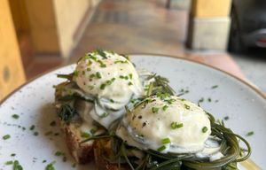 Griddled bread with seasonal vegetables, poached egg and cheese fondue at Baak Libreria Bistrot in Bologna