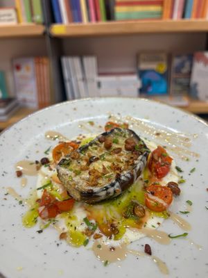 Roasted aubergine with tahini sauce and lemon zest at Baak Libreria Bistrot in Bologna
