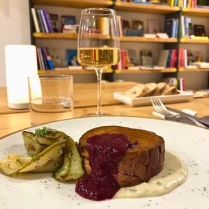 Grilled “Filetto” with herb béchamel, red fruit coulis and seasonal vegetables at Baak Libreria Bistrot in Bologna