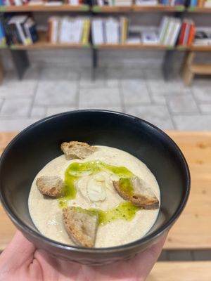 White gazpacho with garlic from Valdichiana, almonds, parsley oil and toasted black bread at Baak Libreria Bistrot in Bologna