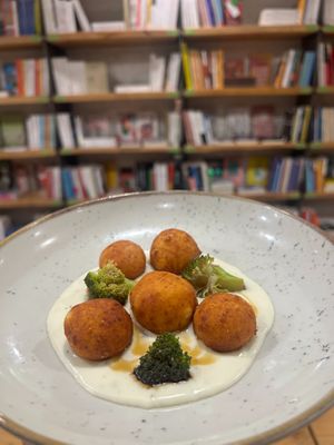 Potato and provola campana ravioli, herb milk cream, balsamic vinegar and marinated seasonal vegetables at Baak Libreria Bistrot in Bologna