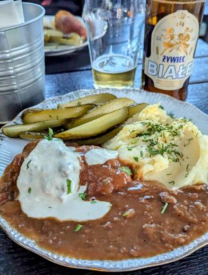 Soya cutlets with mashed potato and pickled cucumbers and Zero Alcohol white beer at Vegan Friends Kitchen in Warsaw