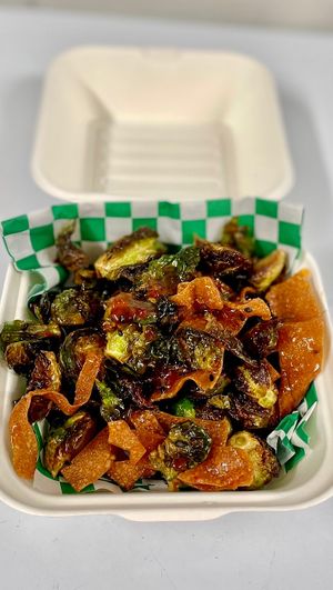 Sweet Chili Brussel Sprouts fried and tossed in trailer-made sweet chili sauce, tm wontons and black sesame seeds. These are gaining popularity among our carnivore friends in town! at That Weird Place in Amarillo