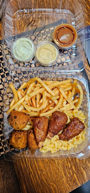 Fries, mac and cheese, vegan wings, and hush puppies at That Weird Place in Amarillo
