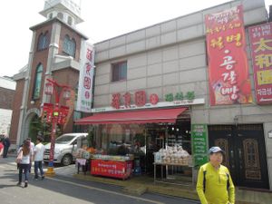 This is the front of Shu Shi Yuan. Notice the Catholic church next door. at Shu Shi Yuan in Incheon