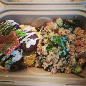 Beet falafel on a bed of hummus with a side of quinoa and spinach salad. Yum! at Verdine - Food Truck in Houston