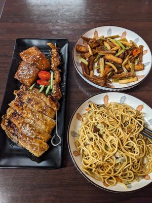 Hakka stir-fry 客家小炒 , fried noodles 禾喜炒麵， BBQ chicken 燒烤G排, Dried tofu豆乾, Skewer 醬燒麵腸, total ~ 390ntd at Hexi Vegan in New Taipei City