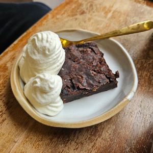 Brownie with whipped cream at Das Lazy in Vienna