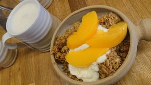 Baked oats with vegan yoghurt and peaches and a London Fog with oat milk at Five Acres in St Andrews